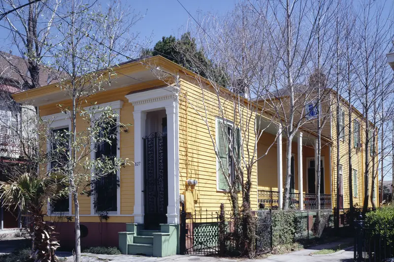 A yellow shotgun house in the Bywater neighborhood of New Orleans