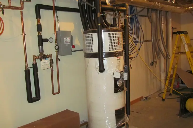A tank water heater installed with copper piping in a utility room